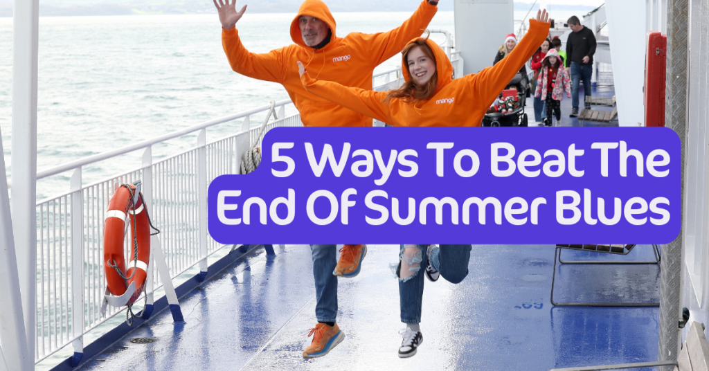 5 ways to beat the summer blues. two people walking in the rain with orange jumpers.